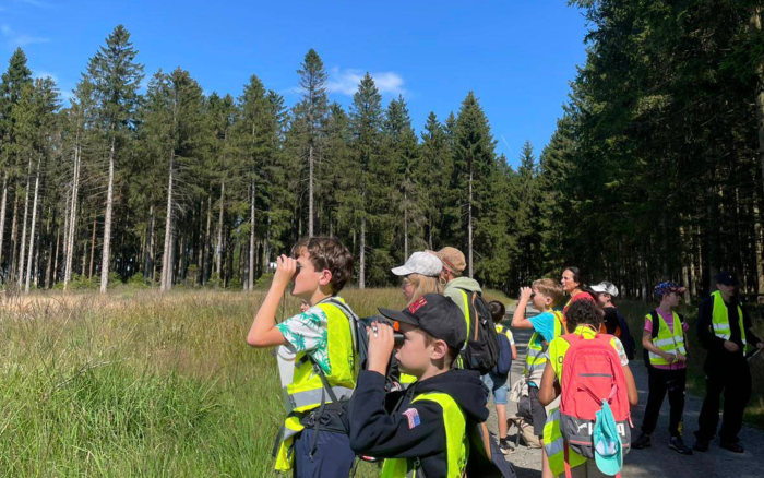 kids looking with binoculars