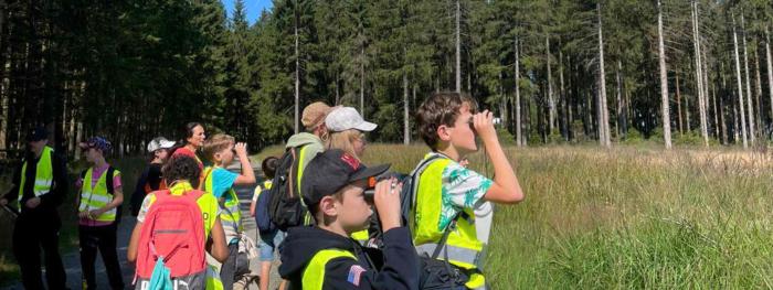 kids looking with binoculars