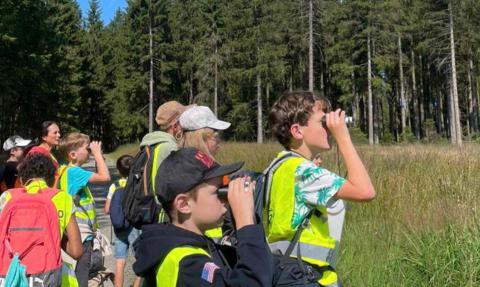 kids looking with binoculars